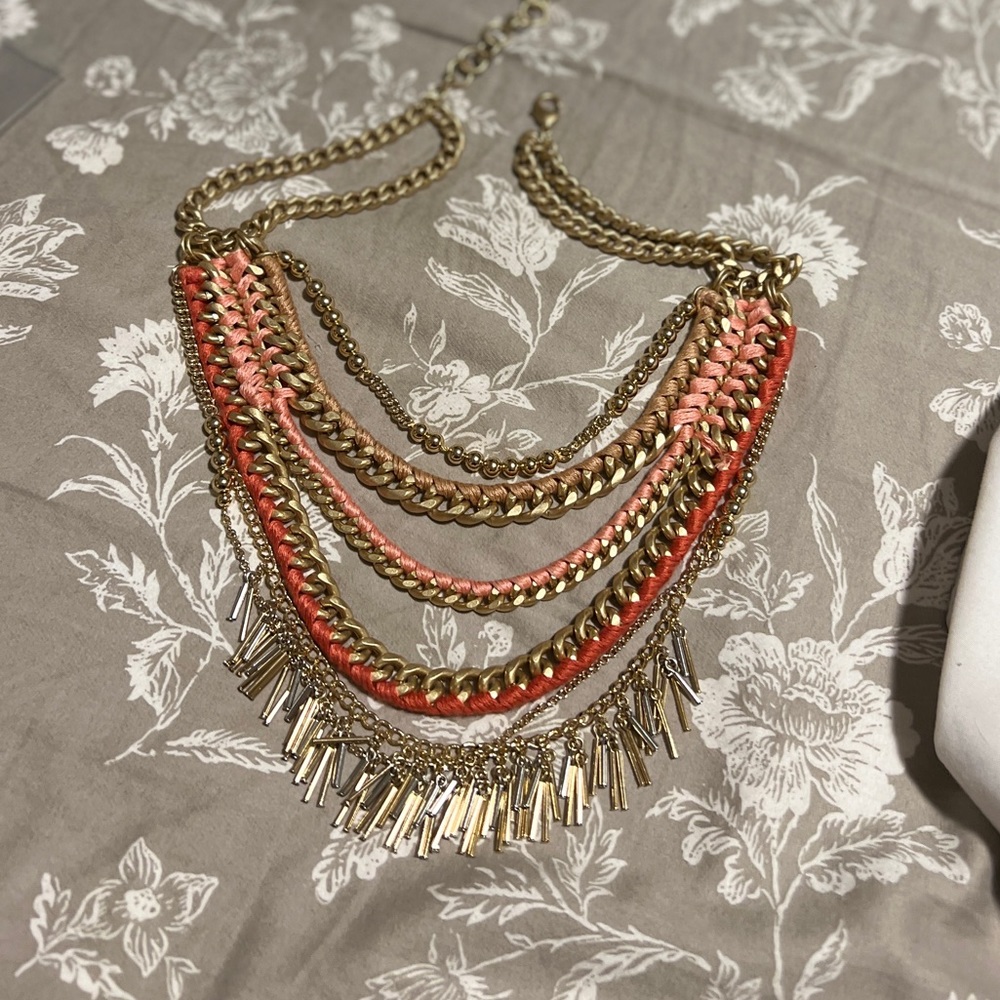 Gorgeous gold necklace with coral toned accents